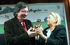 Sergio Olgu&iacute;n y Beatriz de Moura